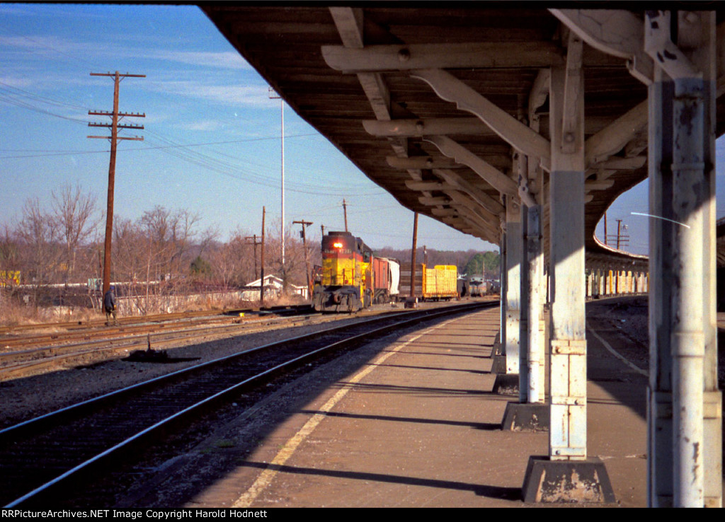 C&O 3877 switches cars beside the Seaboard Station and its curved platforms